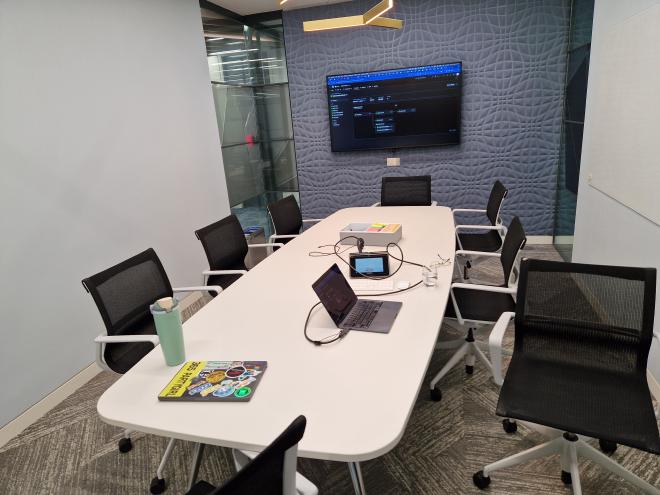 The 3.14 release room, two laptops on a table and the release CI build shown on a screen. The laptop with the “365 PARTYGIRL” sticker isn’t mine.