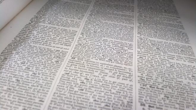 Close up of a dictionary page with dozens of definitions for the word 'get'